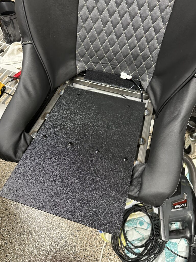 Mounting seat slides and installing the seat heater pads